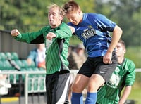 Town book match against mighty Greens