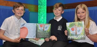 Children delighted by autumnal tale of John and the apple tree