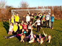 Village celebrates new goal posts with kids vs adults football game