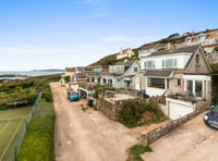 You can watch dolphins from the living room of this coastal home