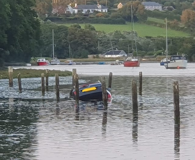 Two rescued as car’s engulfed by incoming tide