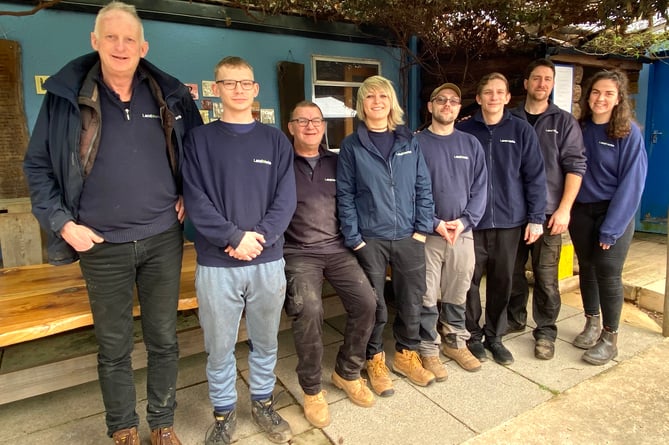 Landworks founder Chris Parsons (left) with trainees and staff