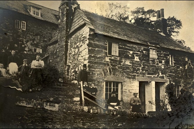 Cottages at South Milton, with group of people outside.  Gentleman at corner of cottage is probably Edmund Steer.