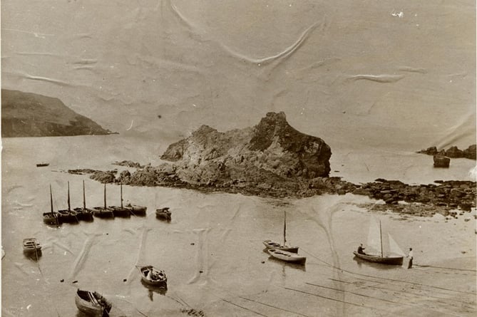 Boats moored at Hope Cove beach. Barney Bank Rock in centre with Bolt Tail on left of picture.  Circa 1900.  Before the Breakwater and sea wall were erected in 1924.