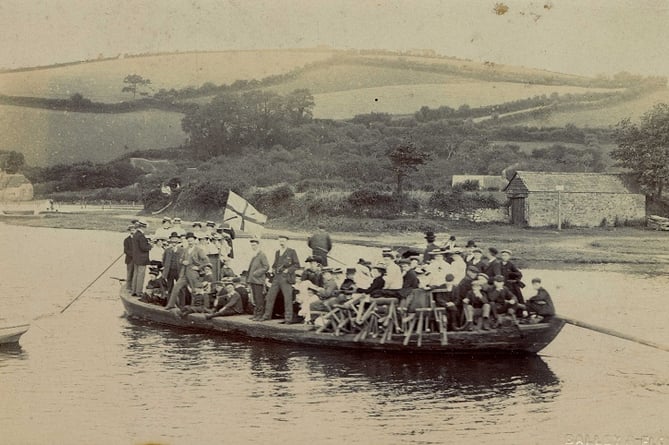 Boat and passengers on river at Aveton Gifford