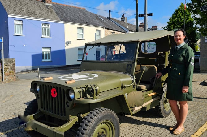 Bethan stands by a WWII Jeep in Ivybridge. Photo: Ivybridge Town Council