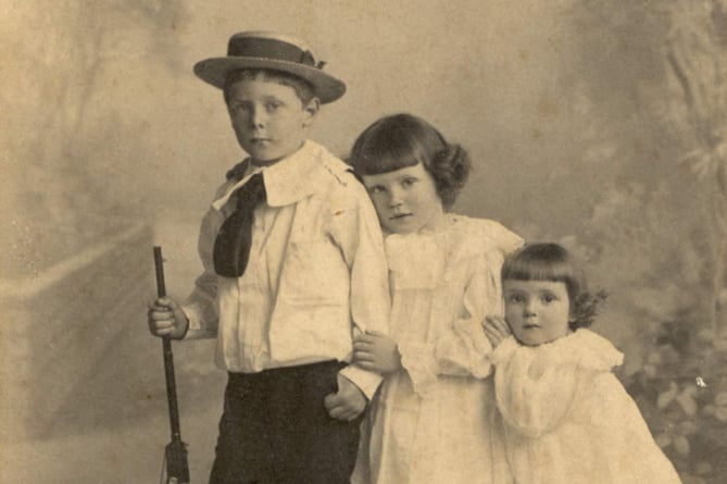 Portrait photo of three grandchildren of Thomas Weymouth. Harold, Gladys and Evelyn Allin, children of Rev and Mrs Allin of Alleron, Loddiswell.