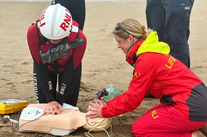 Lifeguards practice resuscitation techniques 