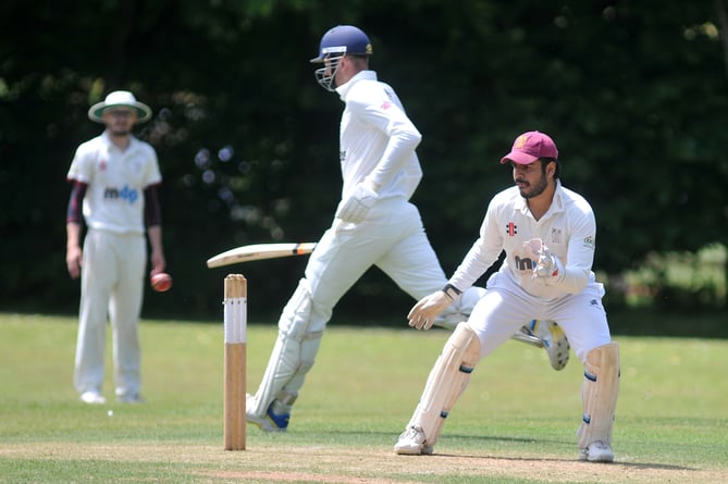 Devon Cricket League B Division. Ipplepen versus Stoke  Gabriel. Stoke 'keeper Abhishek Anand awaits the  ball as  J Colgate makes it to the crease in time