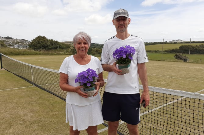 Julie Hanham and Roger Tweedale with their Wimbledon coloured plants