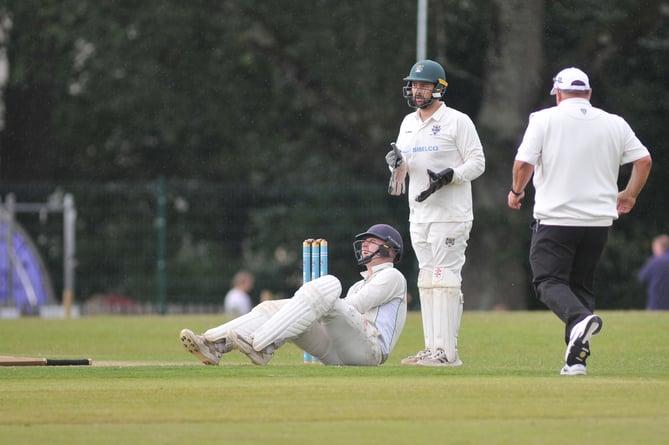 Devon Cricket League Premier  Division West. Bovey Tracey versus Cornwood. Cornwood's George Thompson in agony at the crease after popping his kneecap out (and back in) again. Thompson would retire from the game not out.