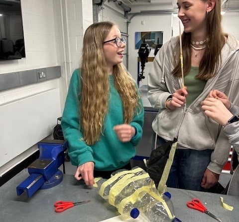 Two students at Dartmouth Academy learn about marine engineering