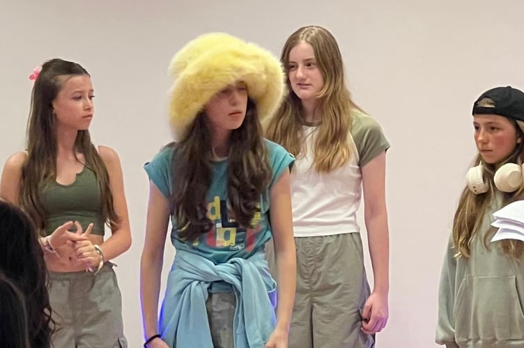 Poppy Gidley, centre, as the dandelion in They Eat Sunshine not Zebras. Background l to r Millie Robinson and Charlotte Boulter. 
Alexandra White (with headphones and cap on)