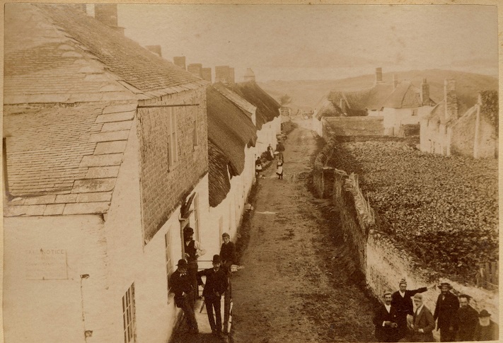 Bantham, showing buildings and small gathering of people