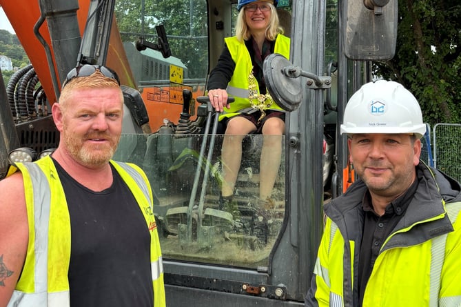 From left: From left: Wayne Brown Regional Manager CAMC, Cllr Emily Price, Mayor of Totnes and Nick Gower Site Foreman Barratt and Canniford.