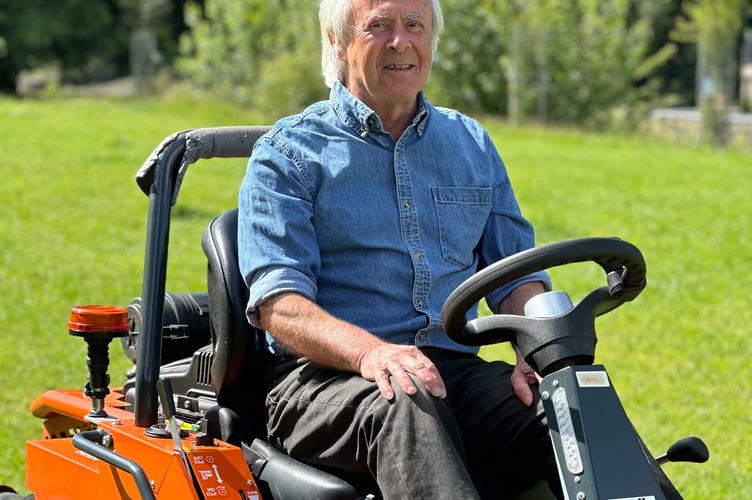 Cllr John McKay tries out the Raccoon mower 