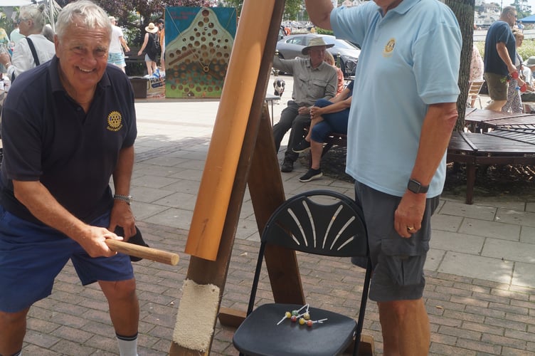 Dartmouth Rotarians Peter Goldstraw and Bernard Young with a Splat the Rat game - Dartmouth Rotary Club 