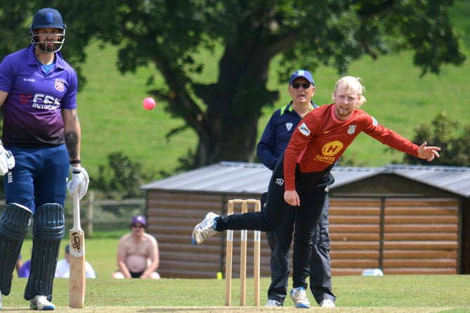 Cullompton captain Brendon Parr (left) watches intently as Stoke Gabriel's Dan Bullock comes in to bowl in Sunday's Corinthian Cup semi-final at Sandford