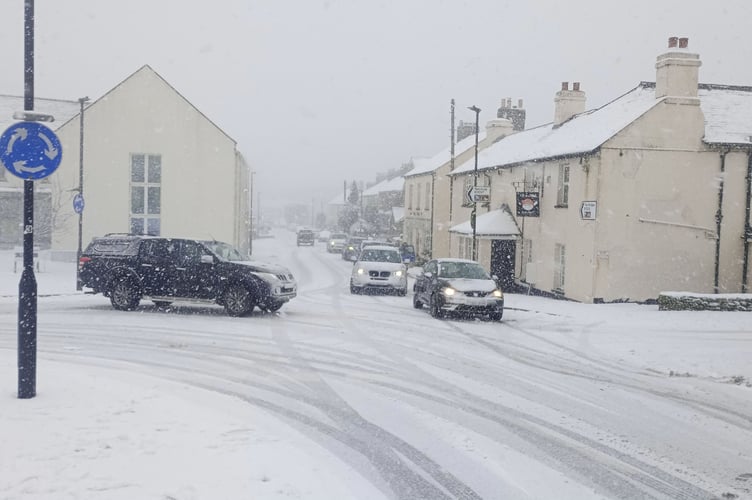 Traffic gingerly negotiating the roads in Princetown this afternoon. Pictured by Miles Fowler